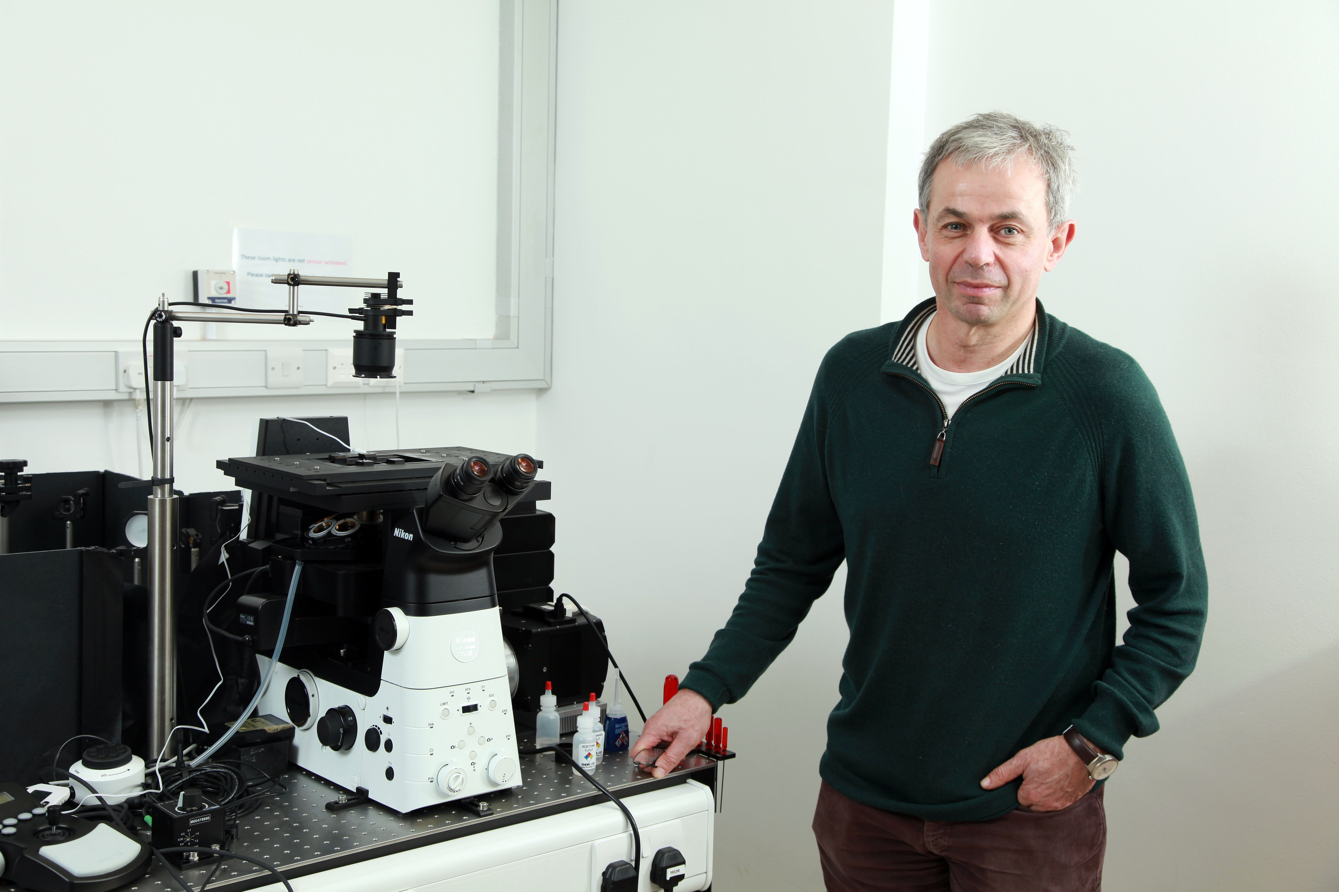 David Klenerman with laboratory equipment