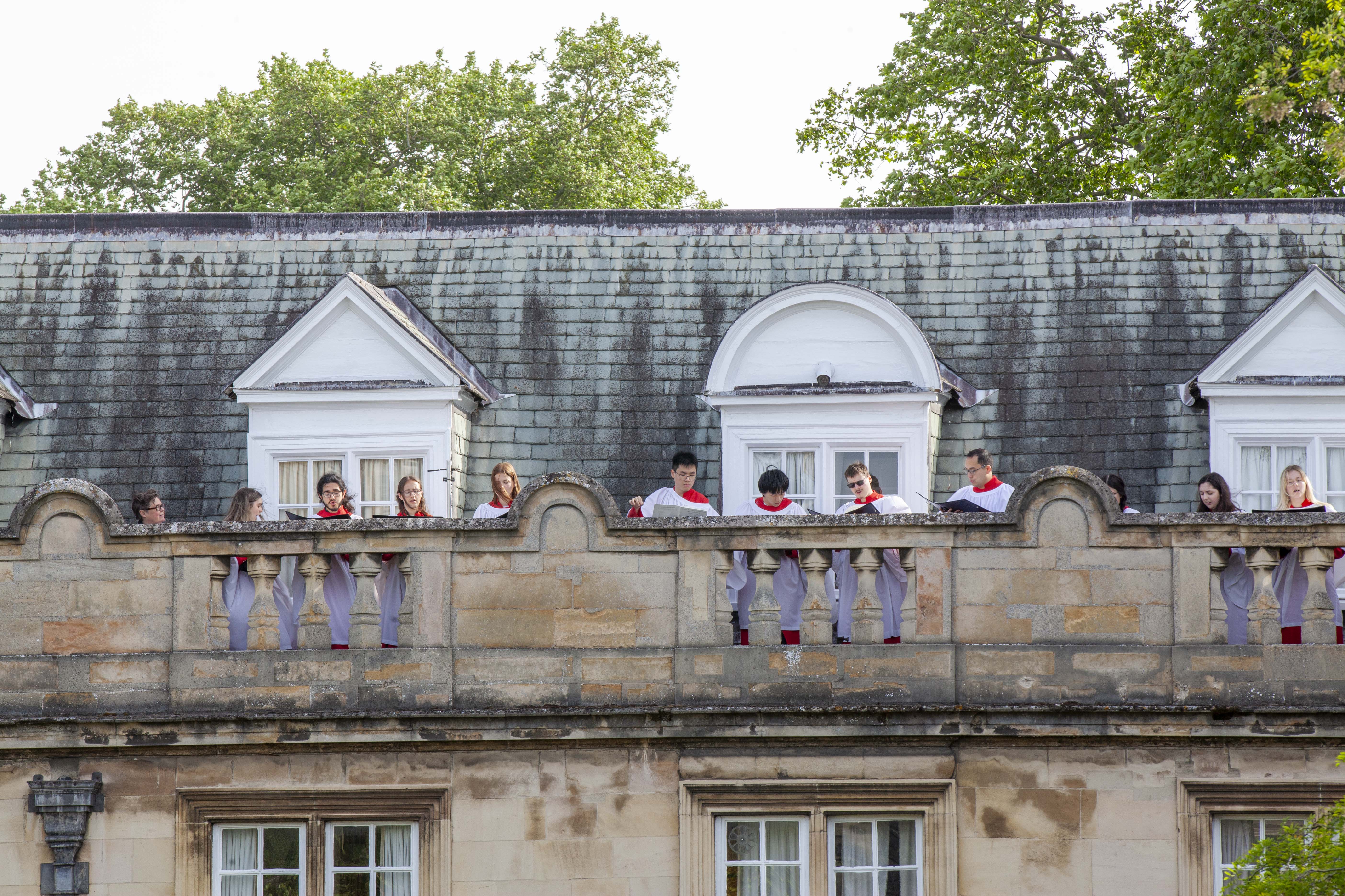 Robed choir members on Fellows' Building